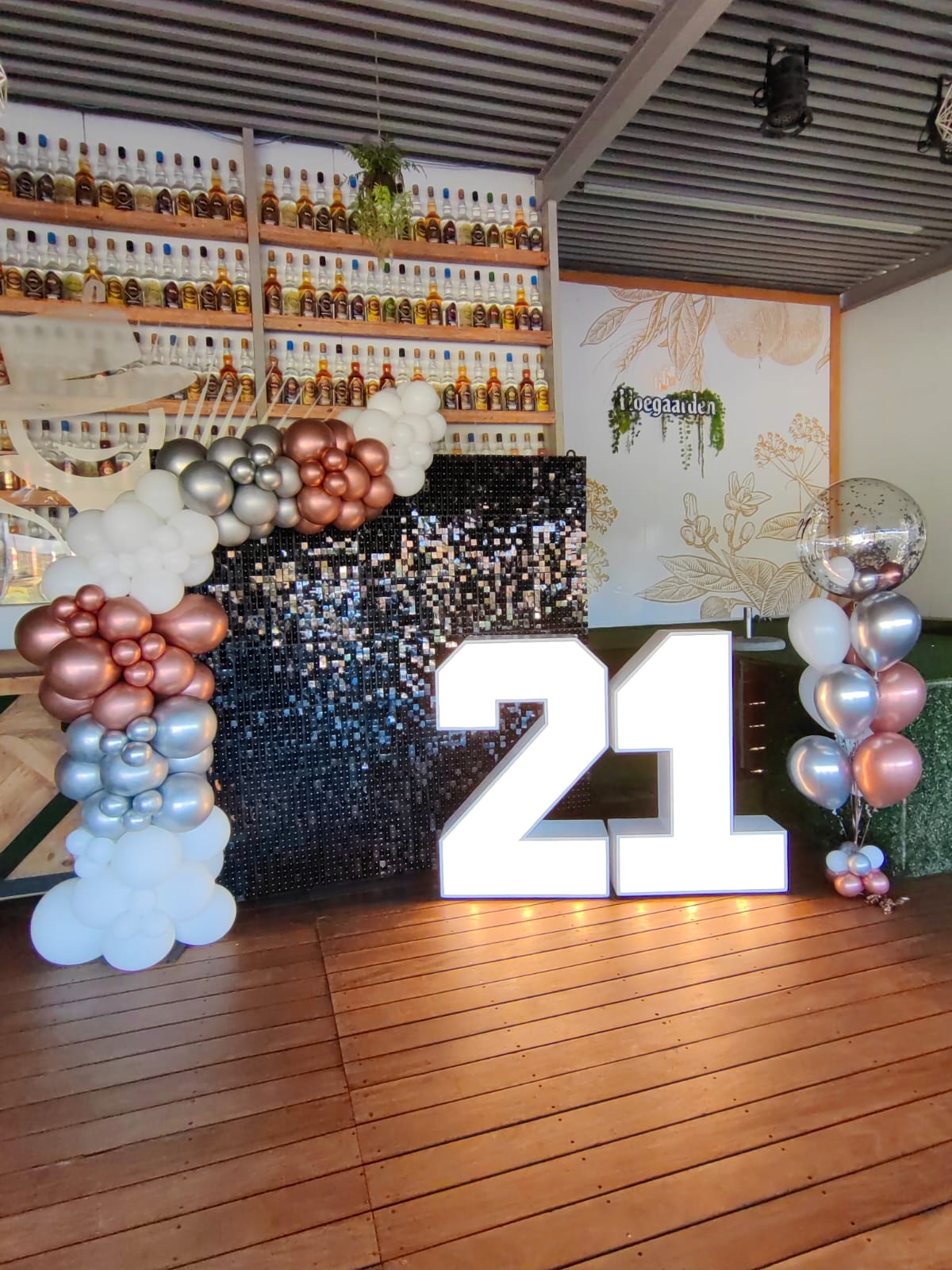 Our beautiful balloon garland, black shimmer backdrop and our 21 Marquee Numbers showing off at Thirsty Scarecrow