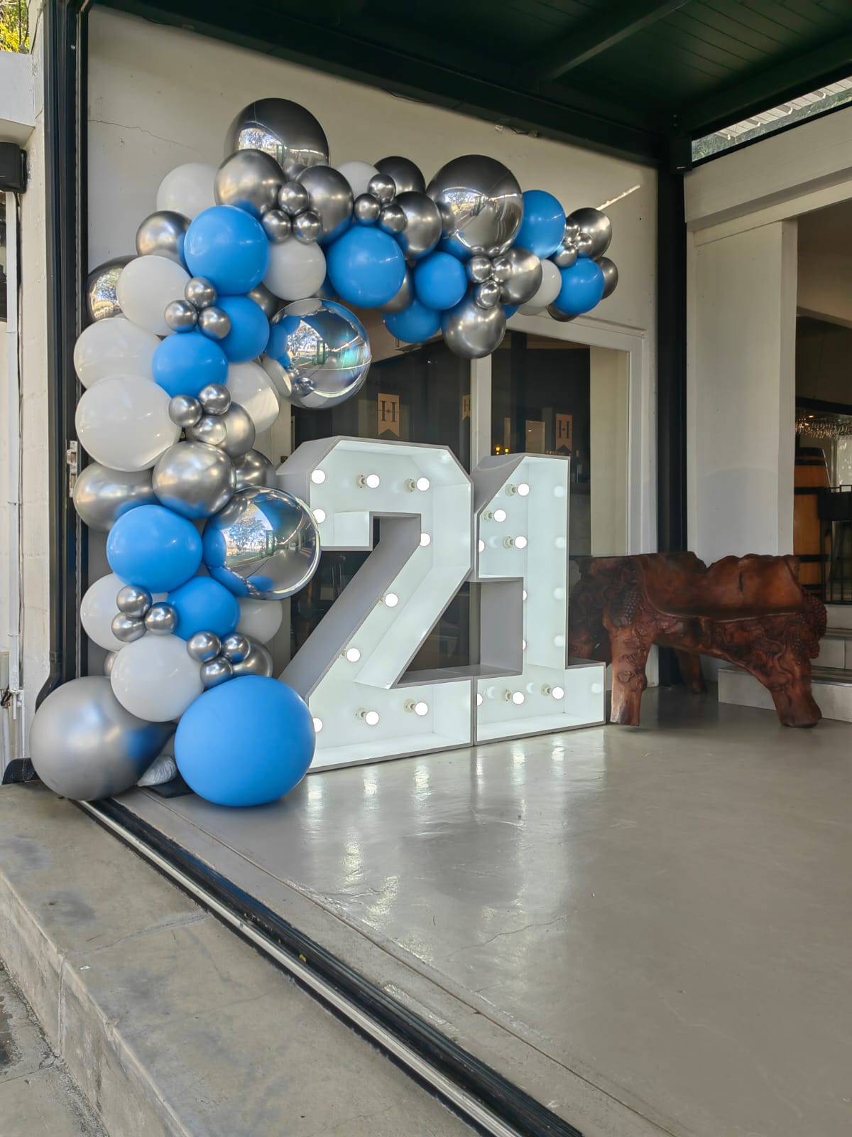 21st Marquee Numbers featuring our blue, white and silver balloon garland